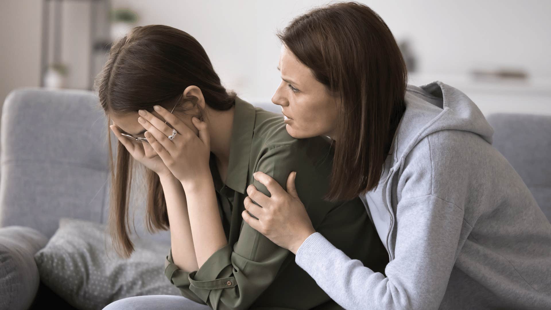 mom comforting her daughter