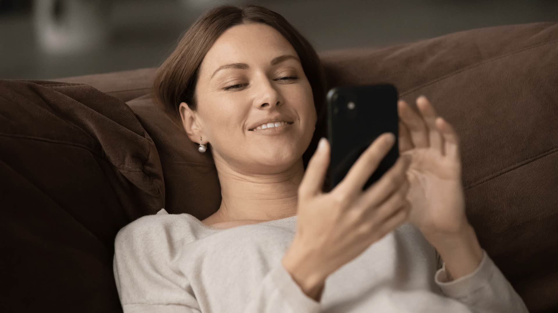 woman scrolling through phone