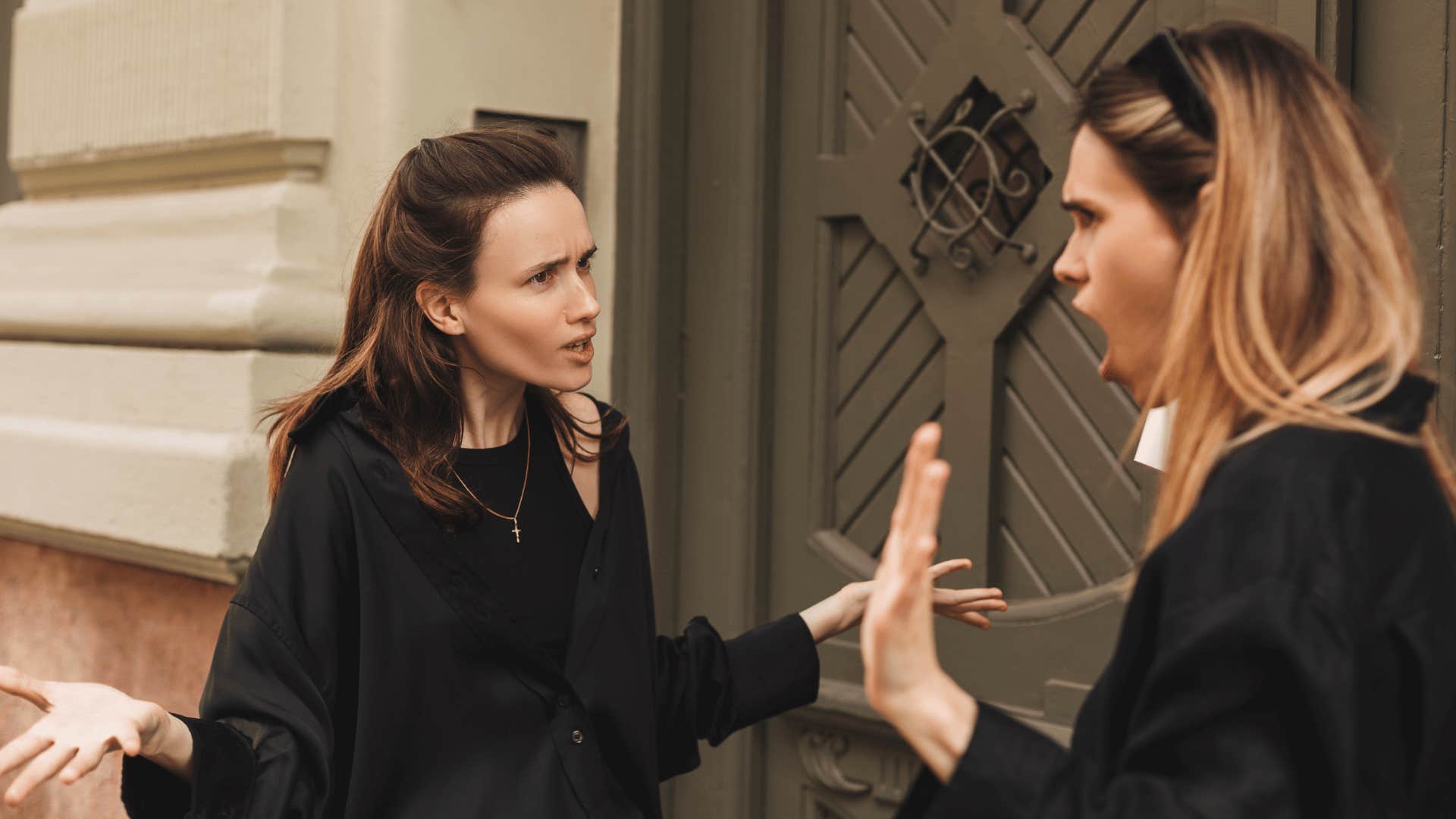 two women arguing outside 