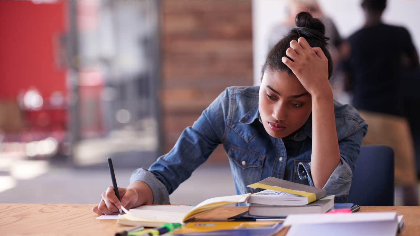 student struggling to read a book