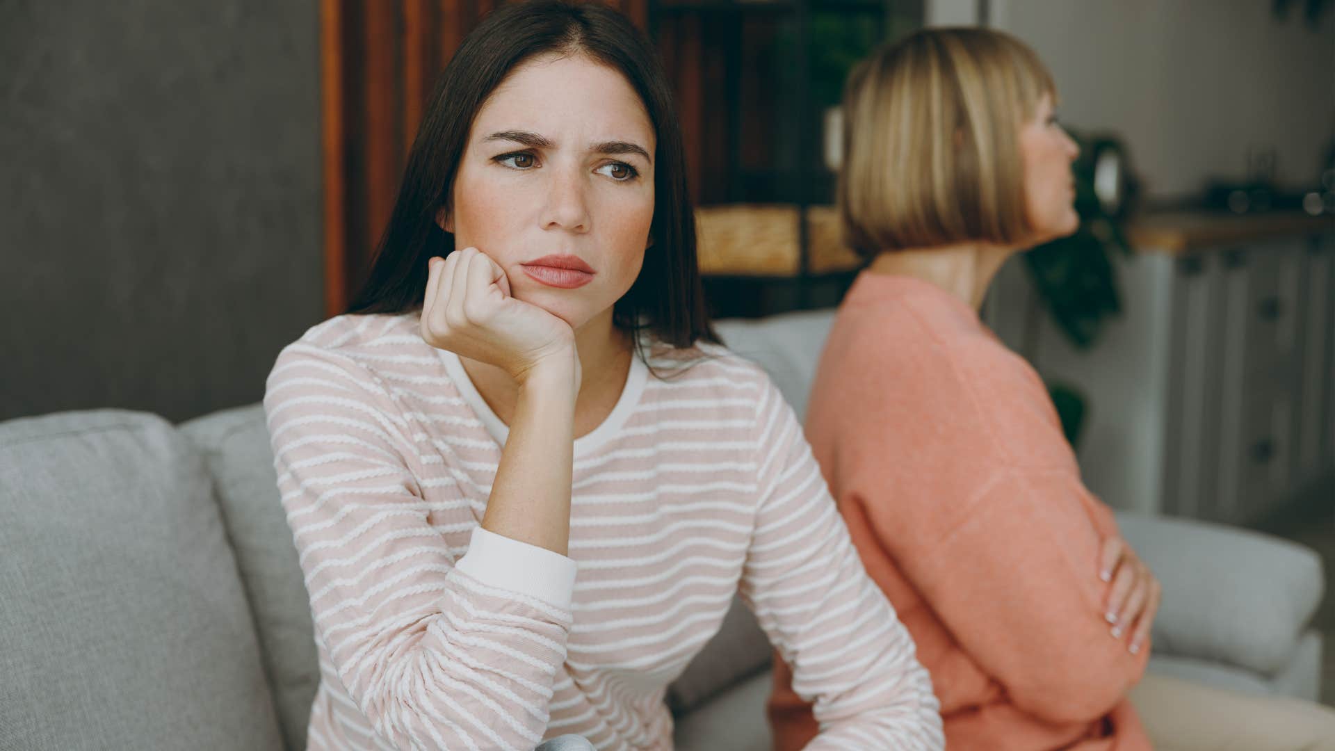 Narcissistic woman looking upset near her mother. 