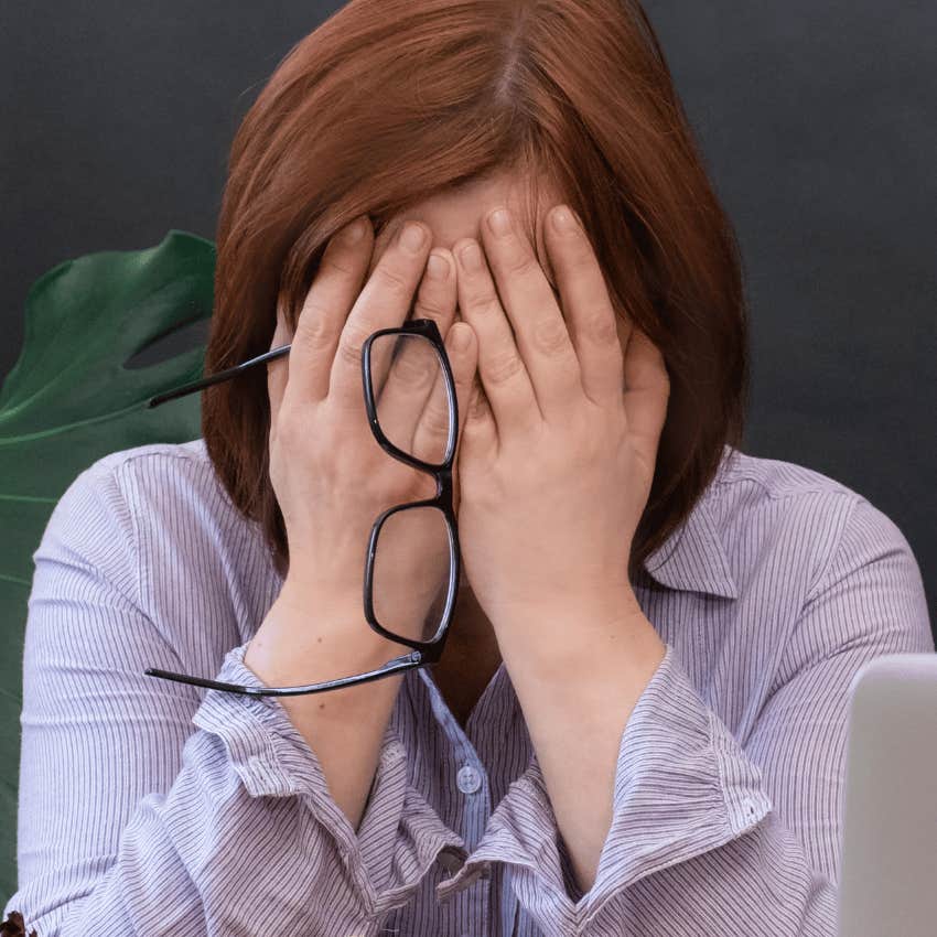 upset woman covered her face