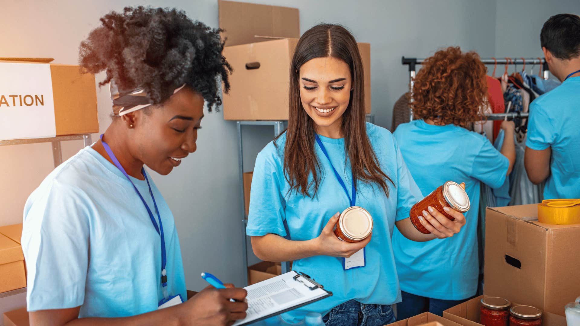 Volunteers at a food bank load boxes