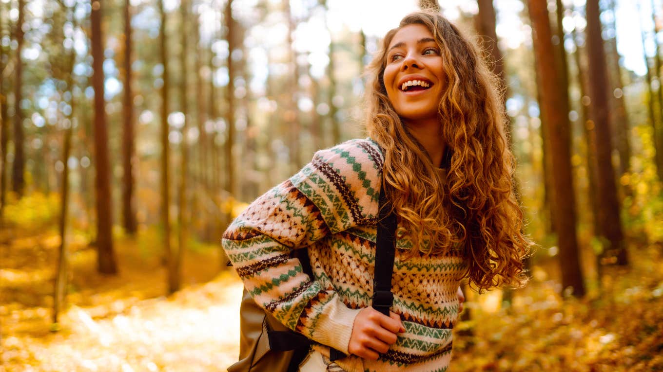 woman taking a walk in the woods