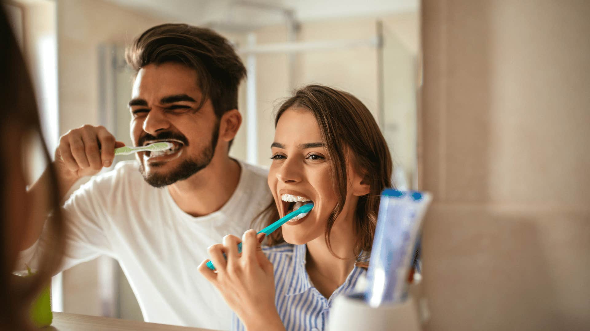 Couple brushes teeth together