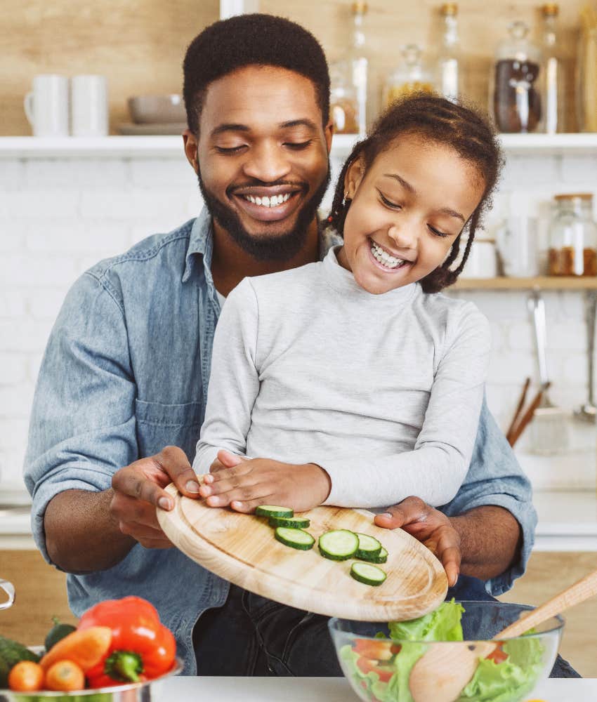 father and daughter cooking together