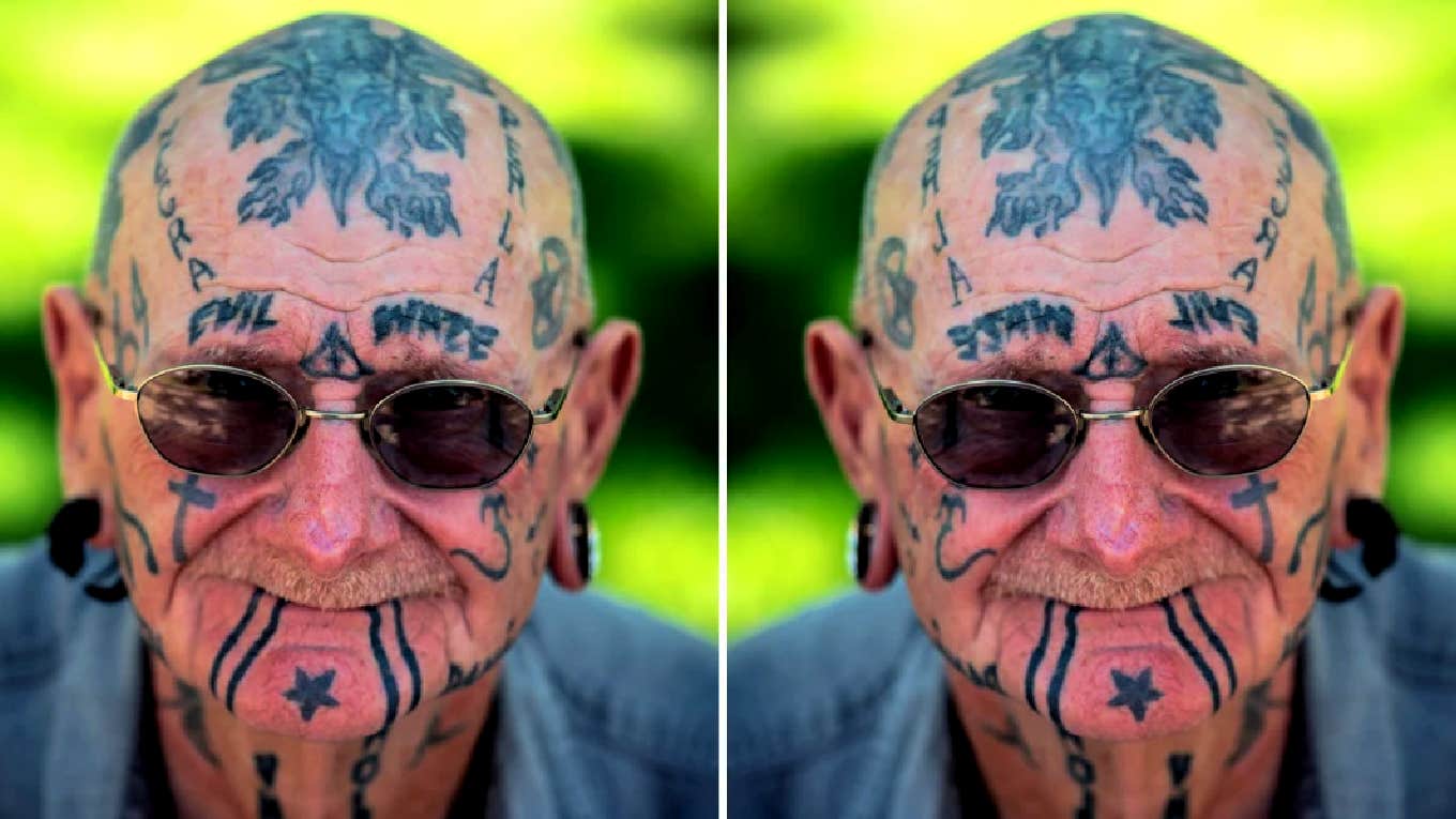 old man with tattooed head and face