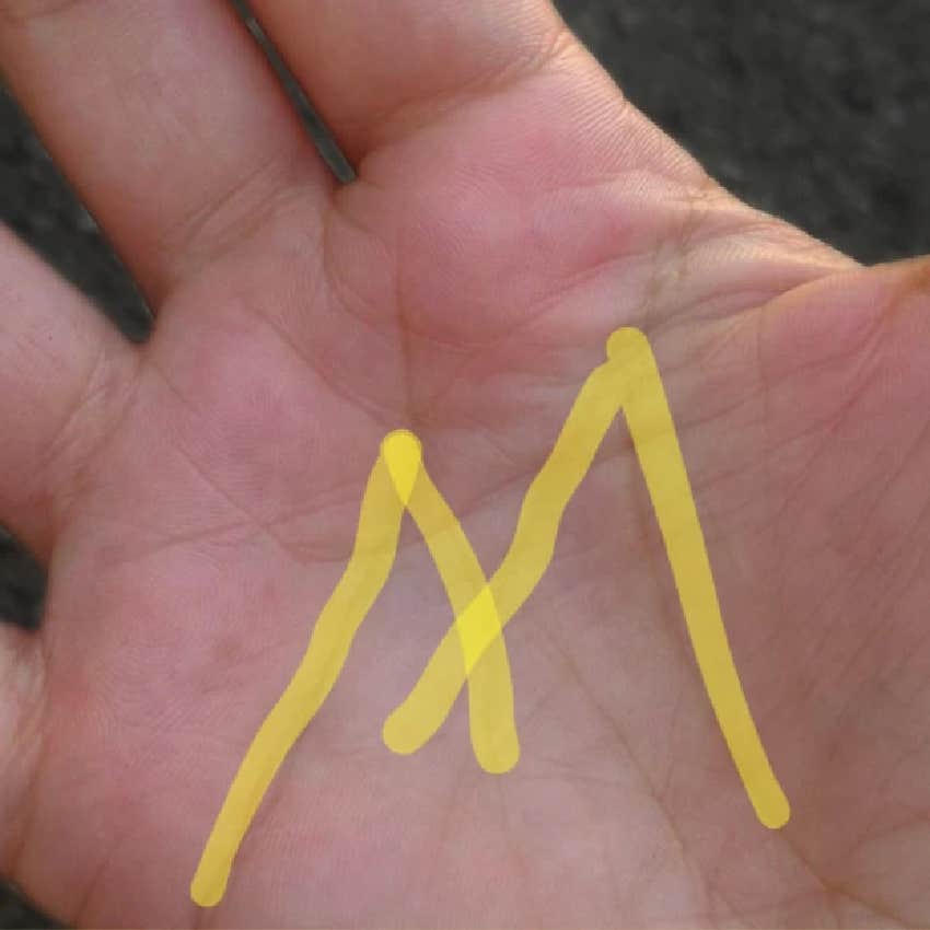 palm with lines that form the letter M