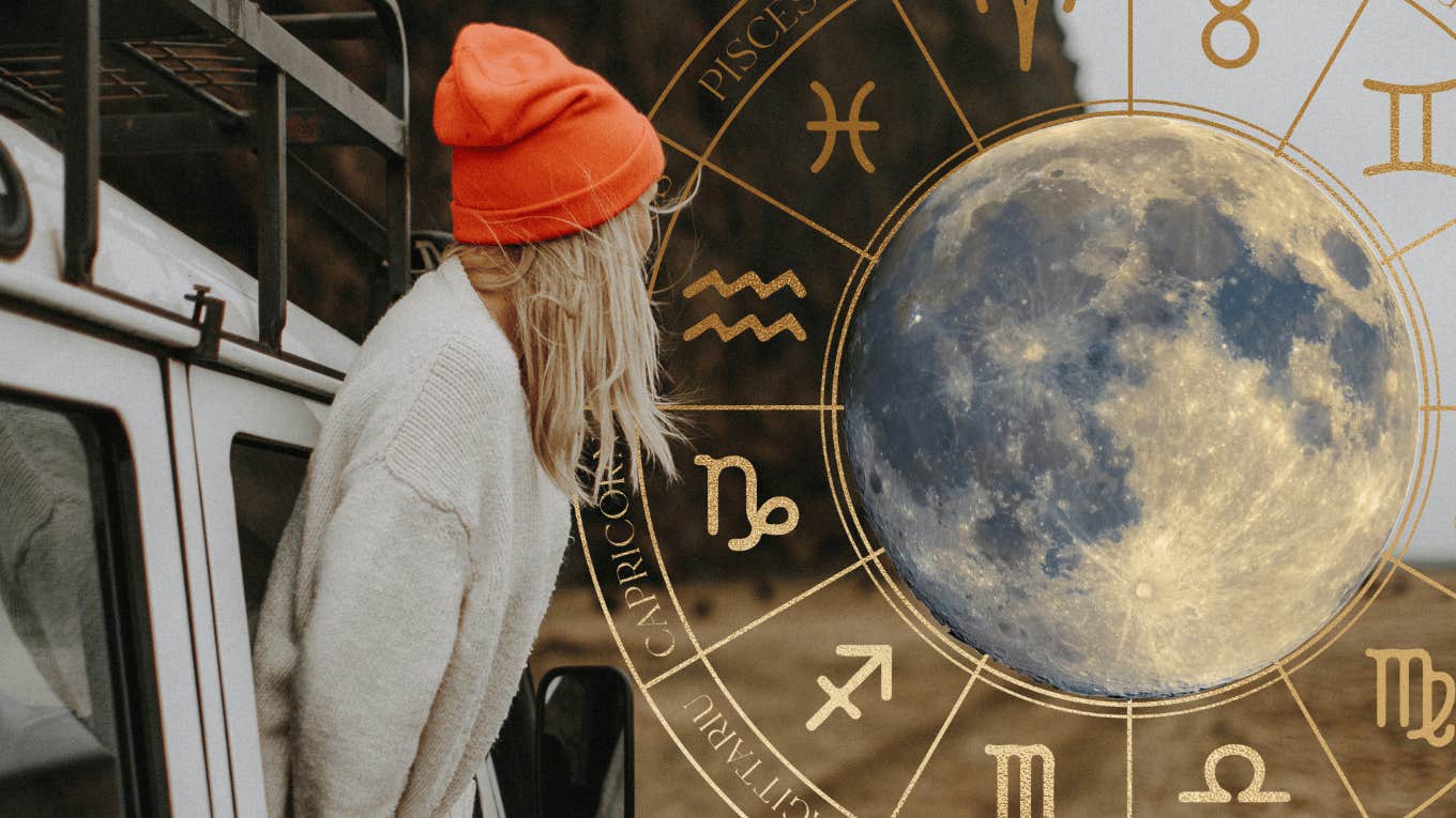 woman looking out a moon sign