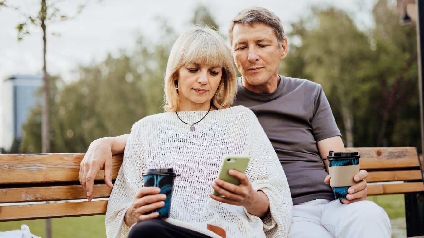 Husband and wife sitting on bench 