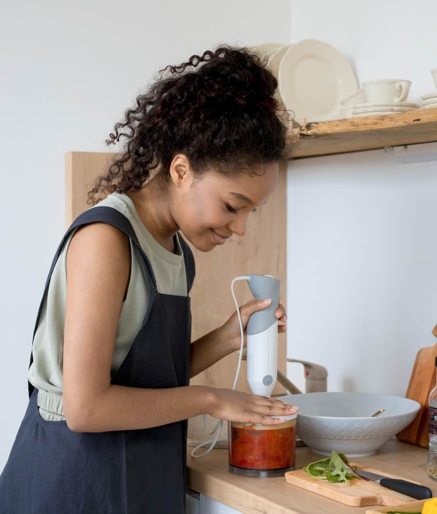 Woman cooking in home kitchen