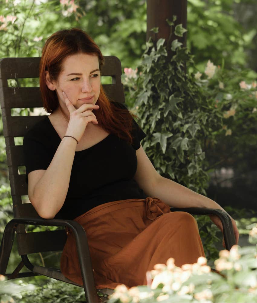 Woman sitting in a garden thinking about life