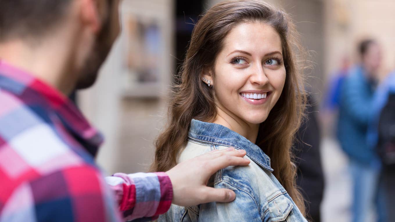 Man approaching woman