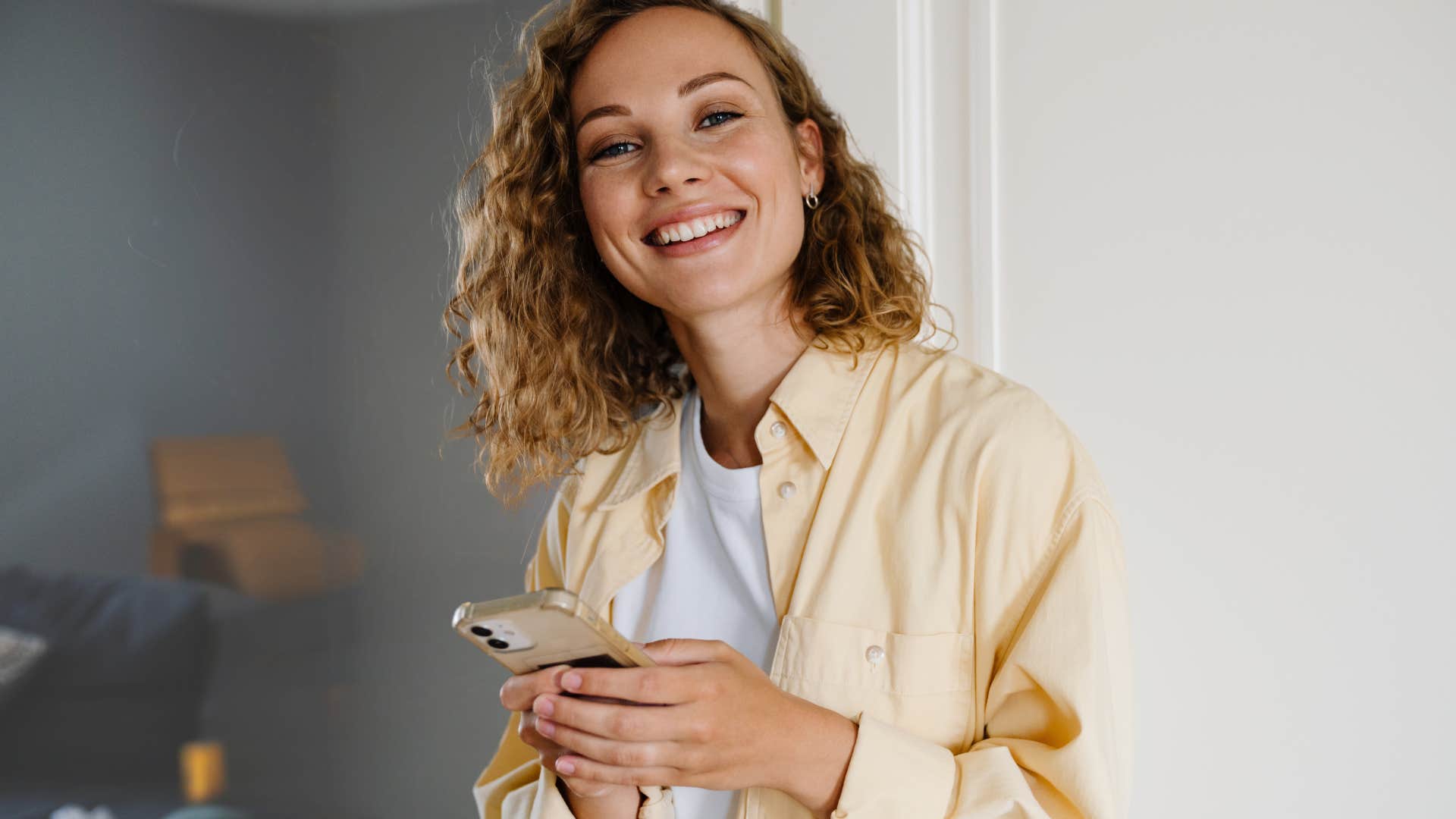 Woman shopping for a sale online on her phone.