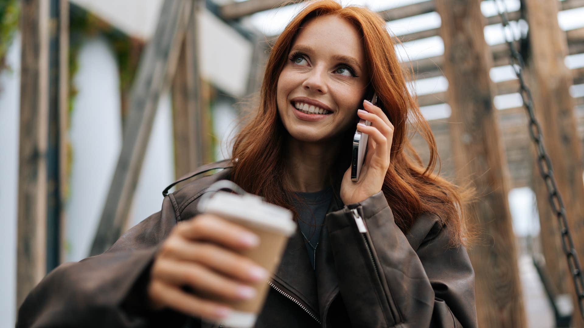 Woman smiling while talking on the phone