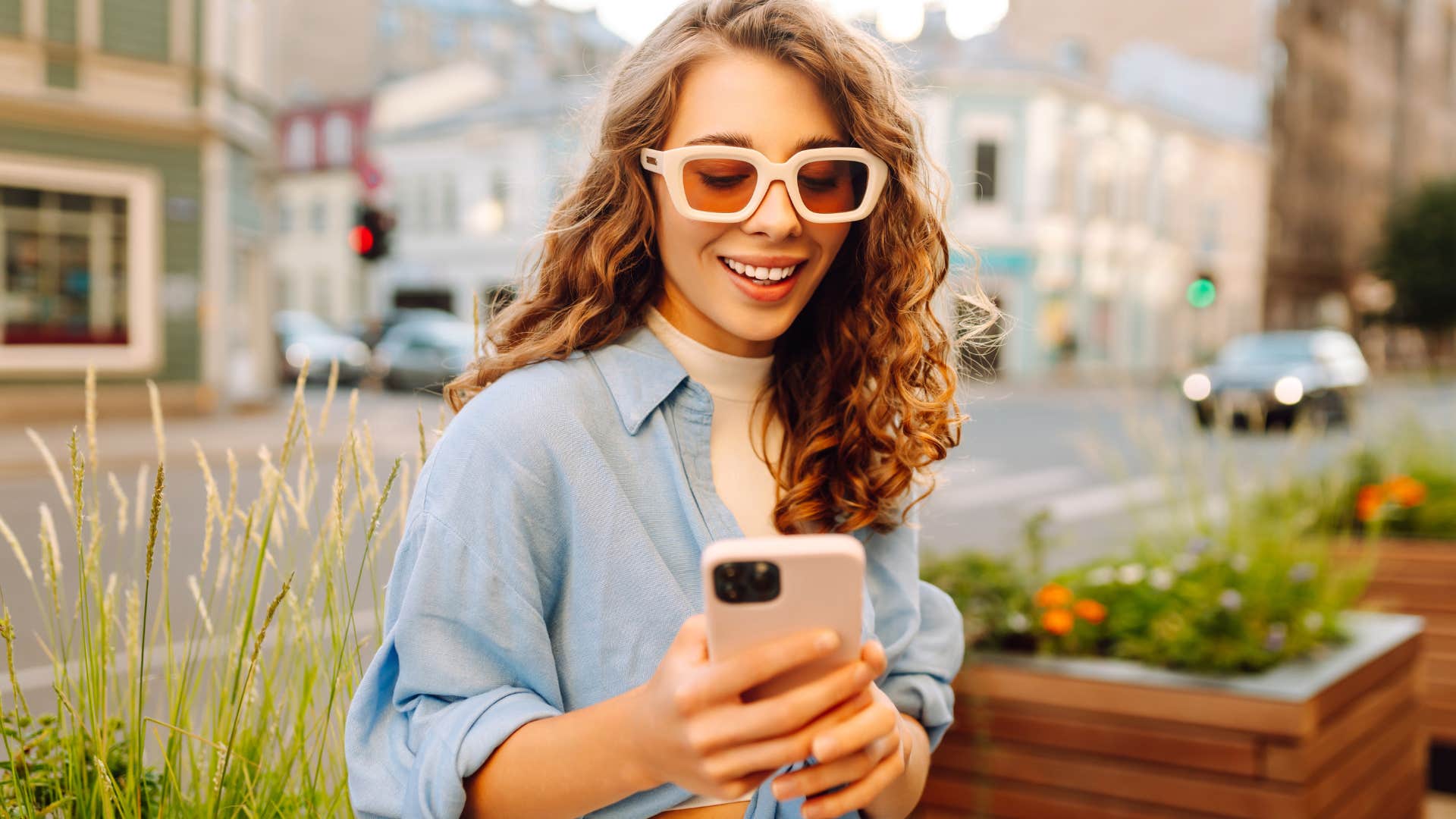 Woman smiling while talking on the phone