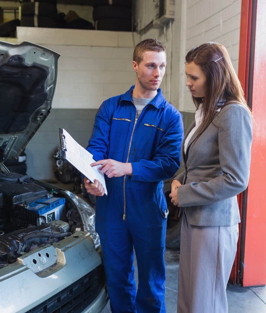 woman talking to mechanic