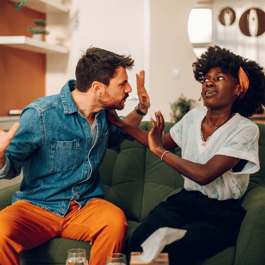 woman trying to push man away