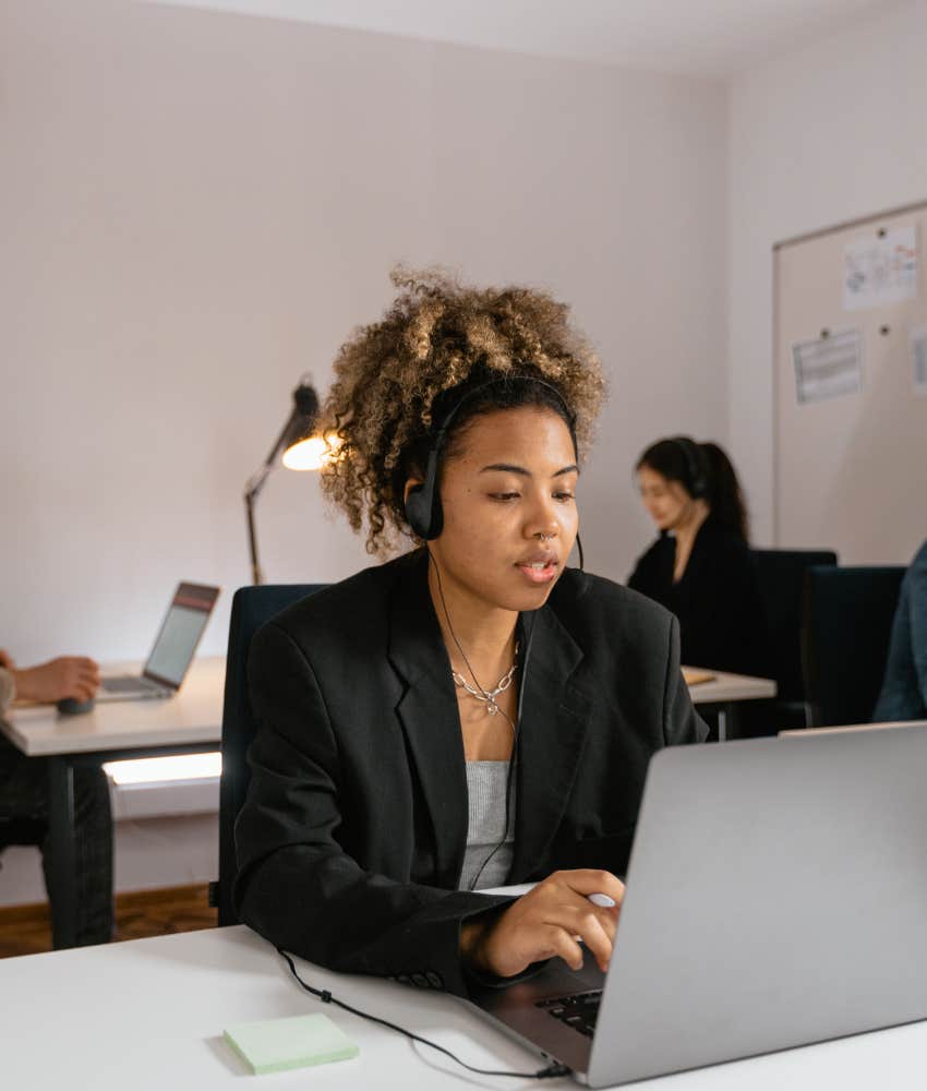 woman working in an office on a laptop