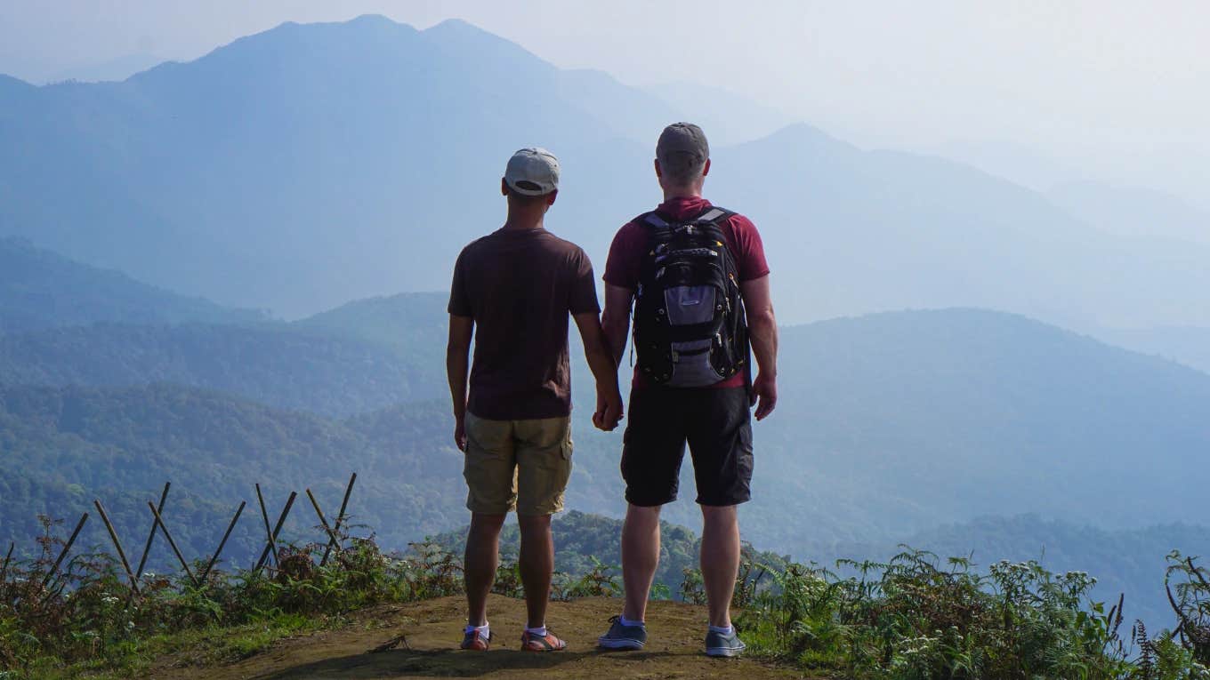 Gay couple on high altitude mountain