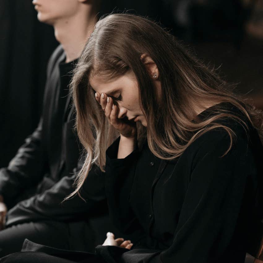 woman's head down in grief