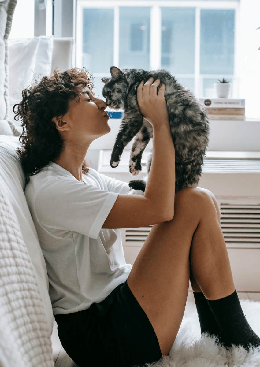 young woman holding a kitten