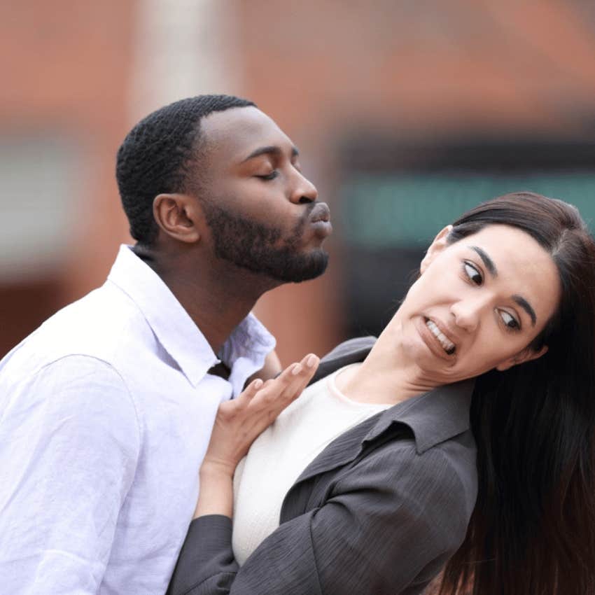 young woman leaning away from man