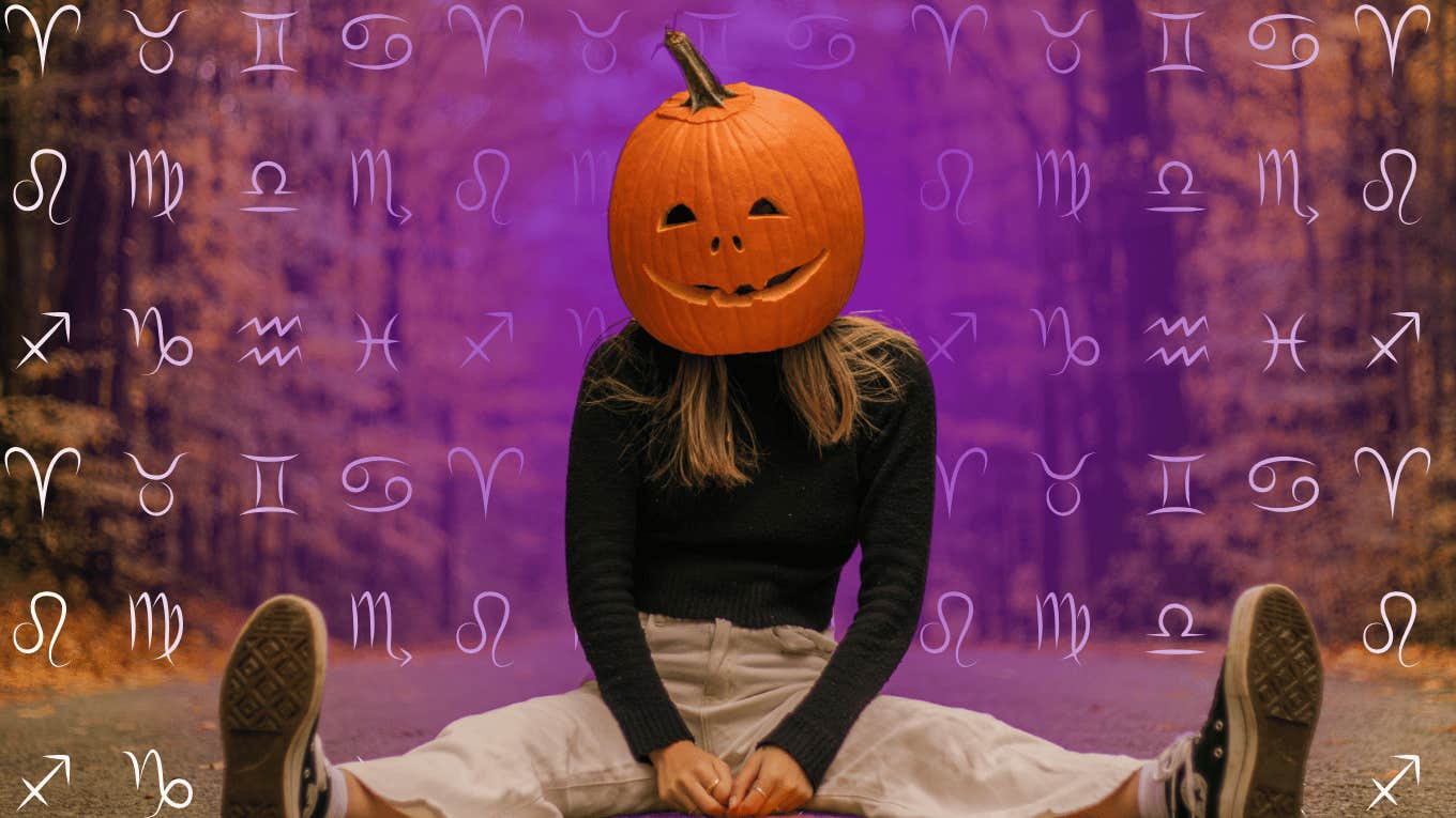 woman wearing pumpkin with zodiac signs having powerful halloween horoscopes october 31, 2024