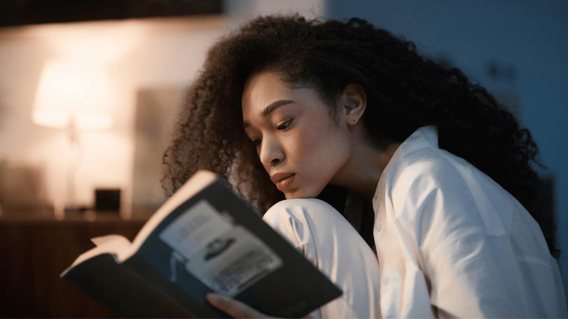 young woman reading alone