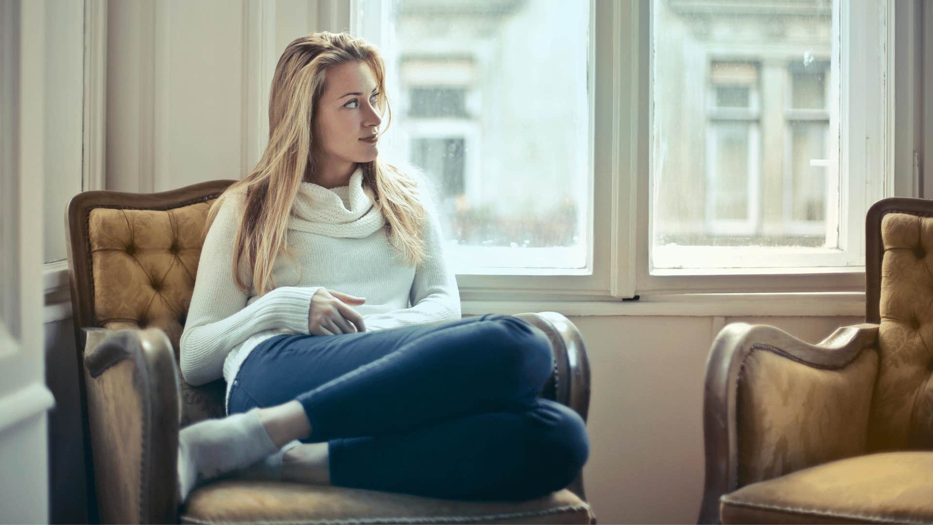 woman sitting near the window