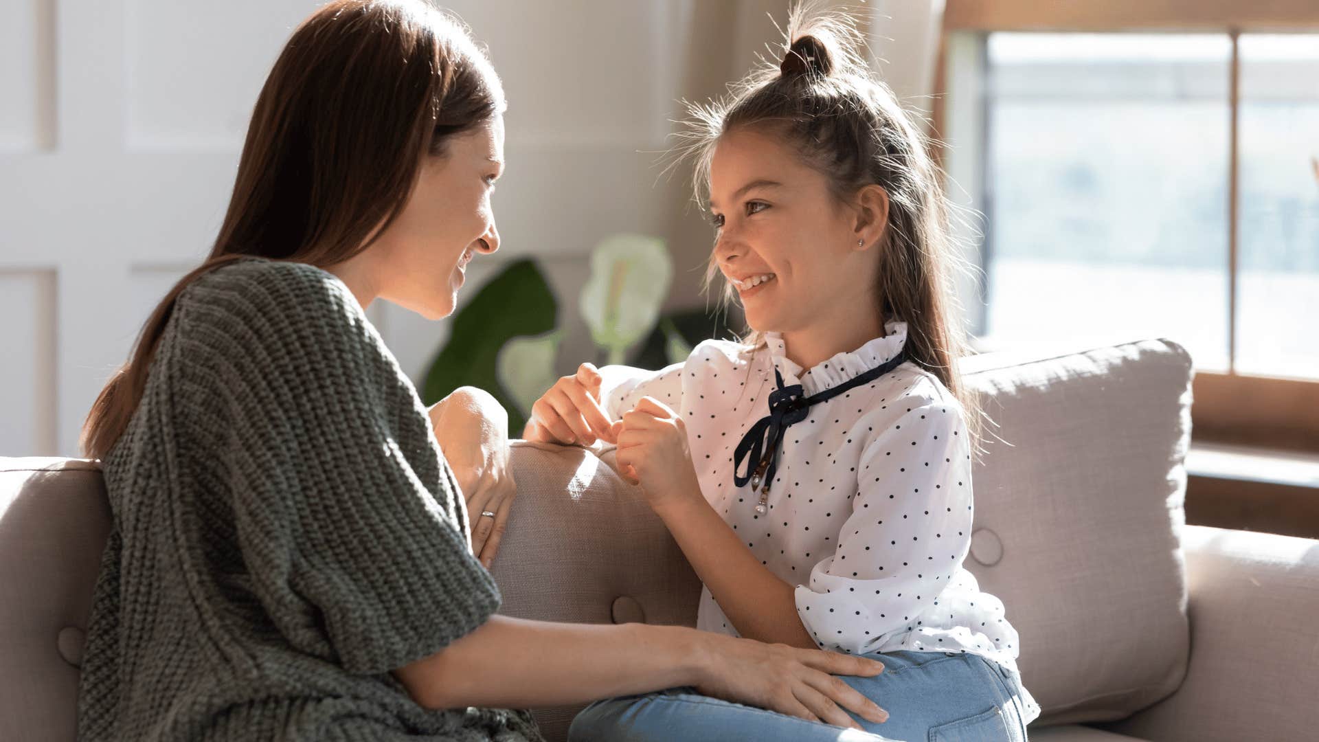 happy girl talking with her happy mom