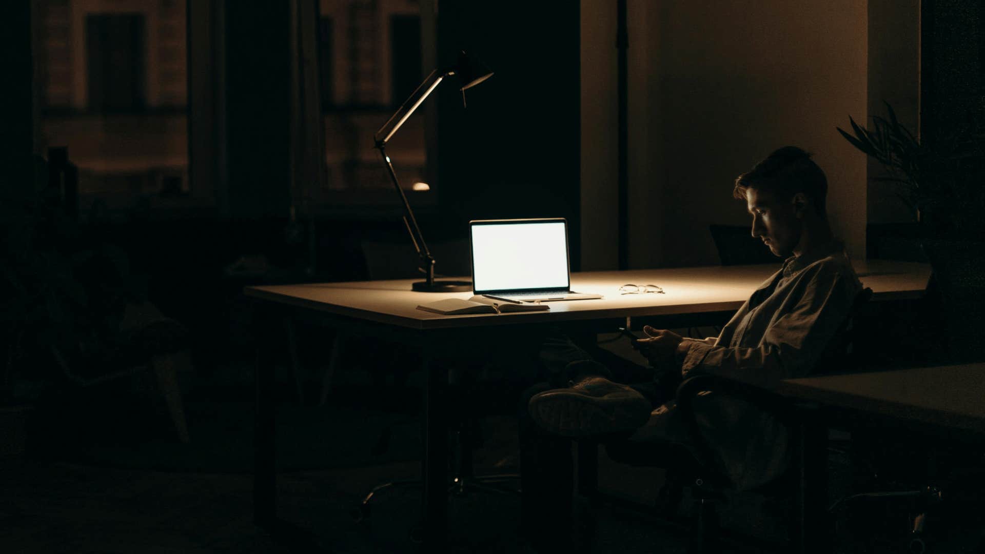 professional man sitting alone in an office