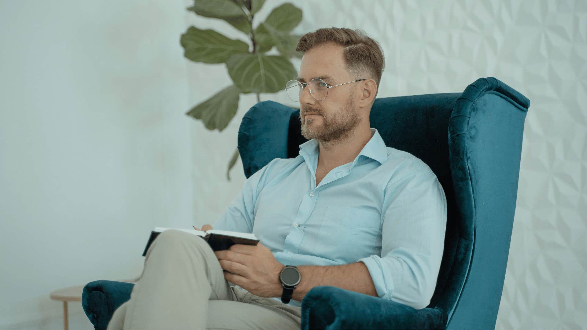 calm professional man sitting in a chair