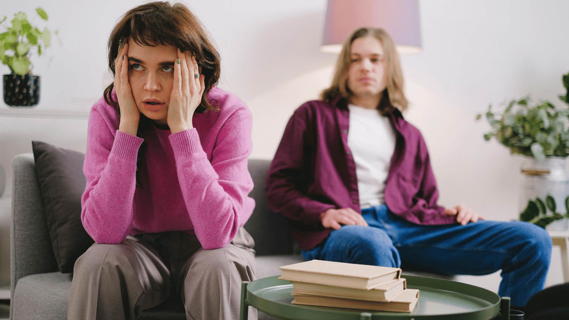 frustrated woman sitting next to a man