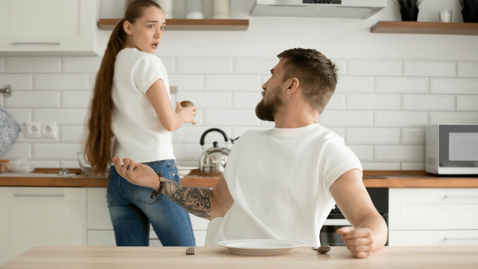 man being rude to surprised woman