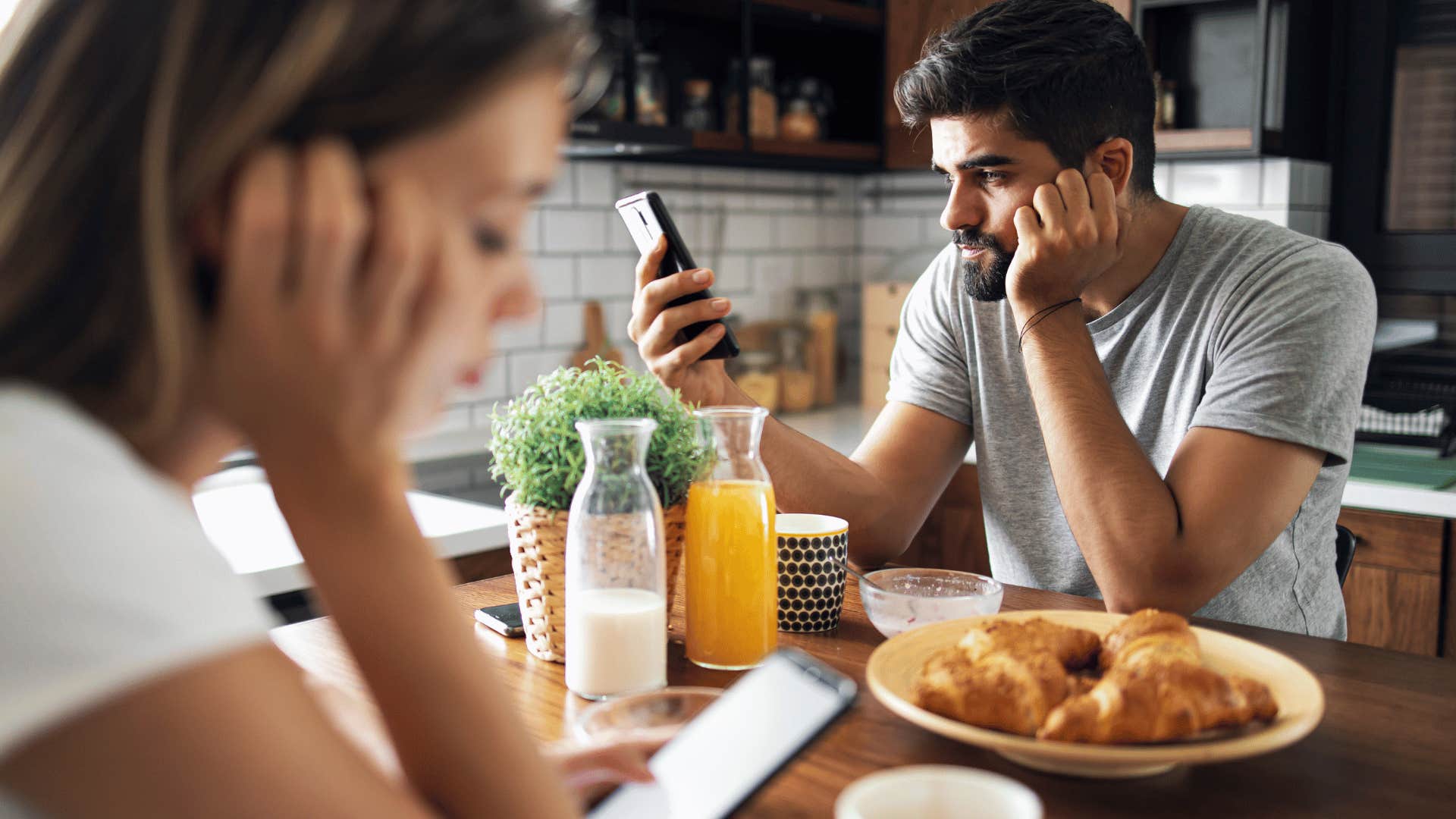 bored couple ignoring each other