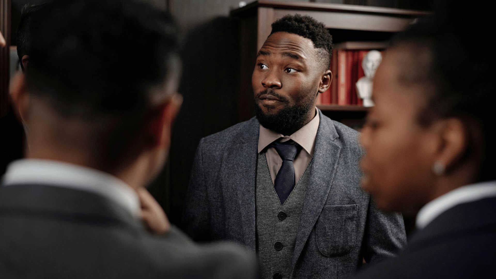 businessman in a suit with raised eyebrows