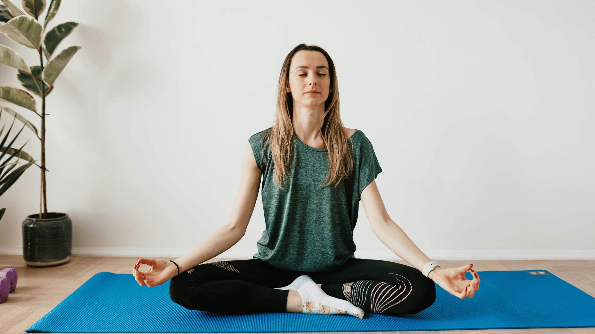 woman with her eyes closed and meditating