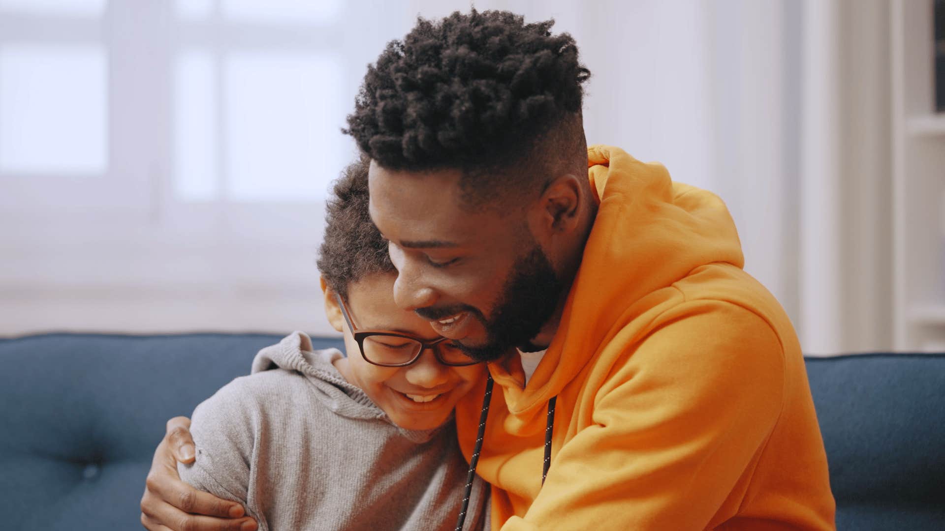 young dad hugging young boy