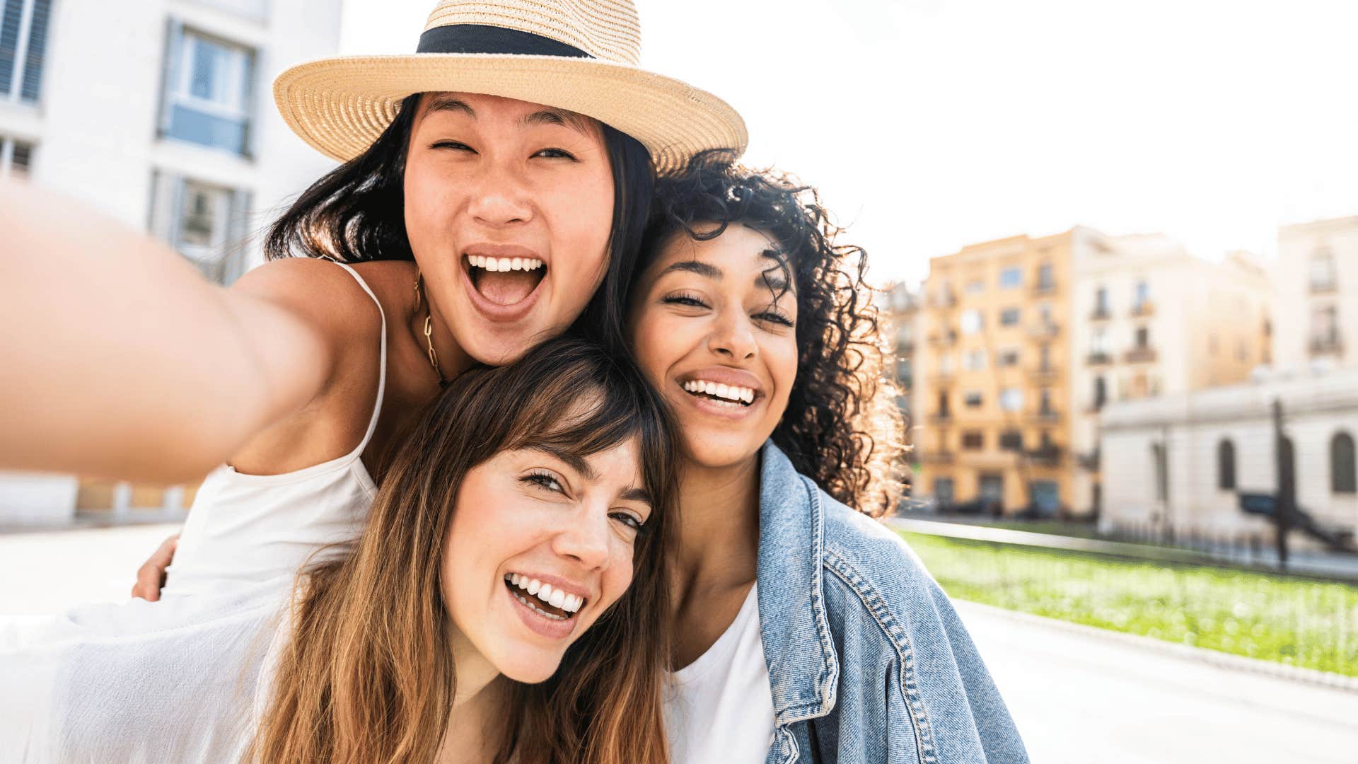 happy three woman posing together