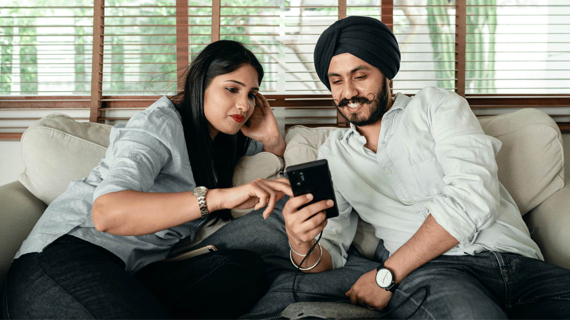 couple looking at a phone screen together