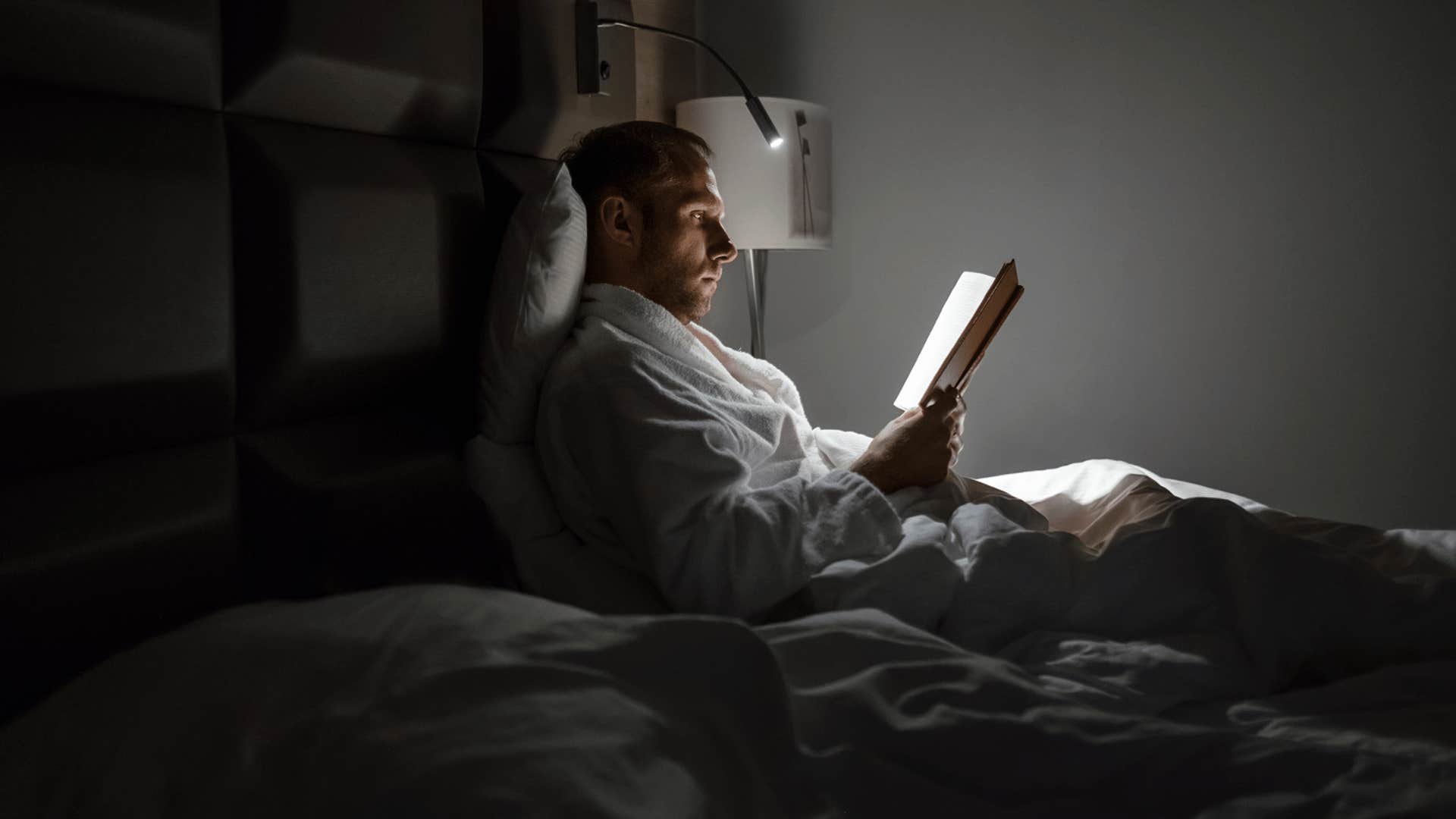 man spending time alone reading