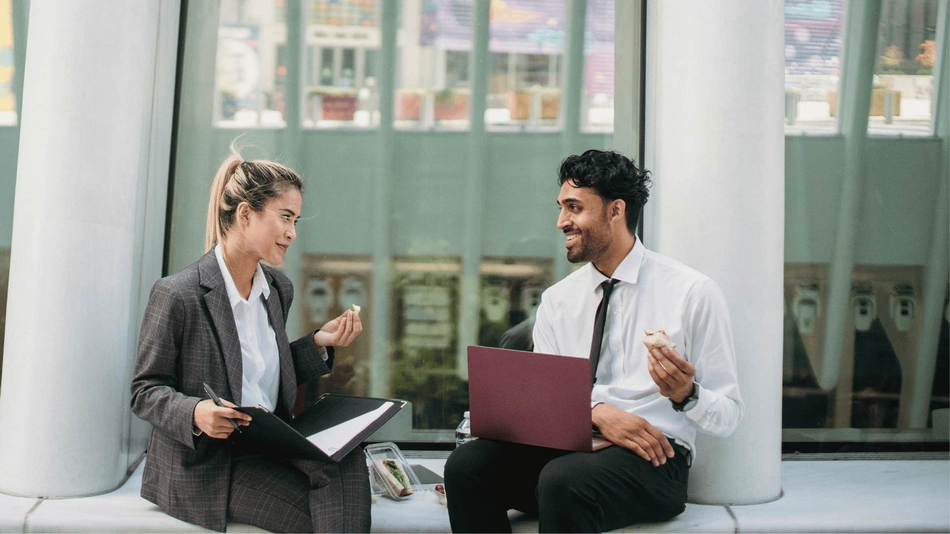 two professionals chatting outdoors