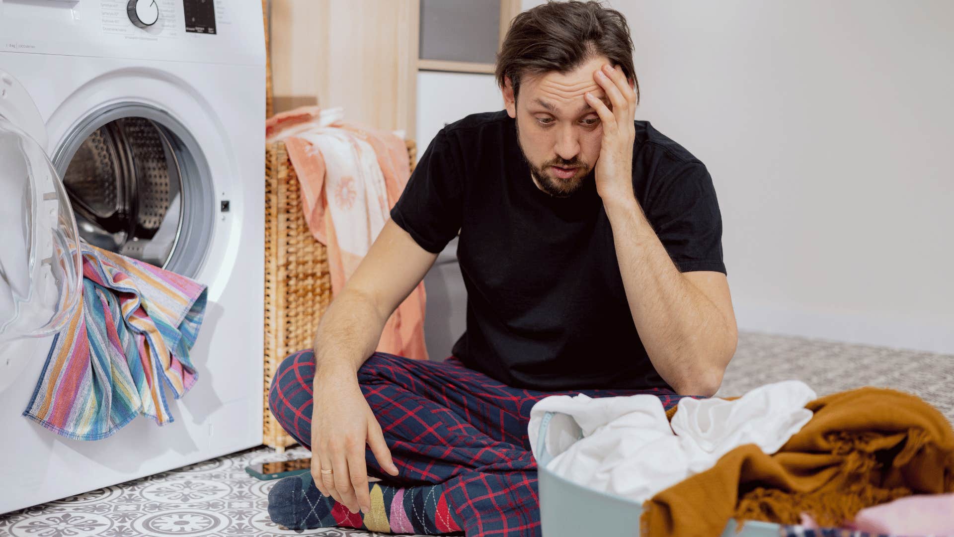 man learning how to do laundry