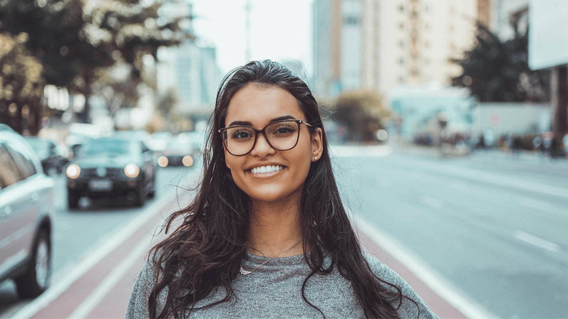 smiling young woman wearing glasses