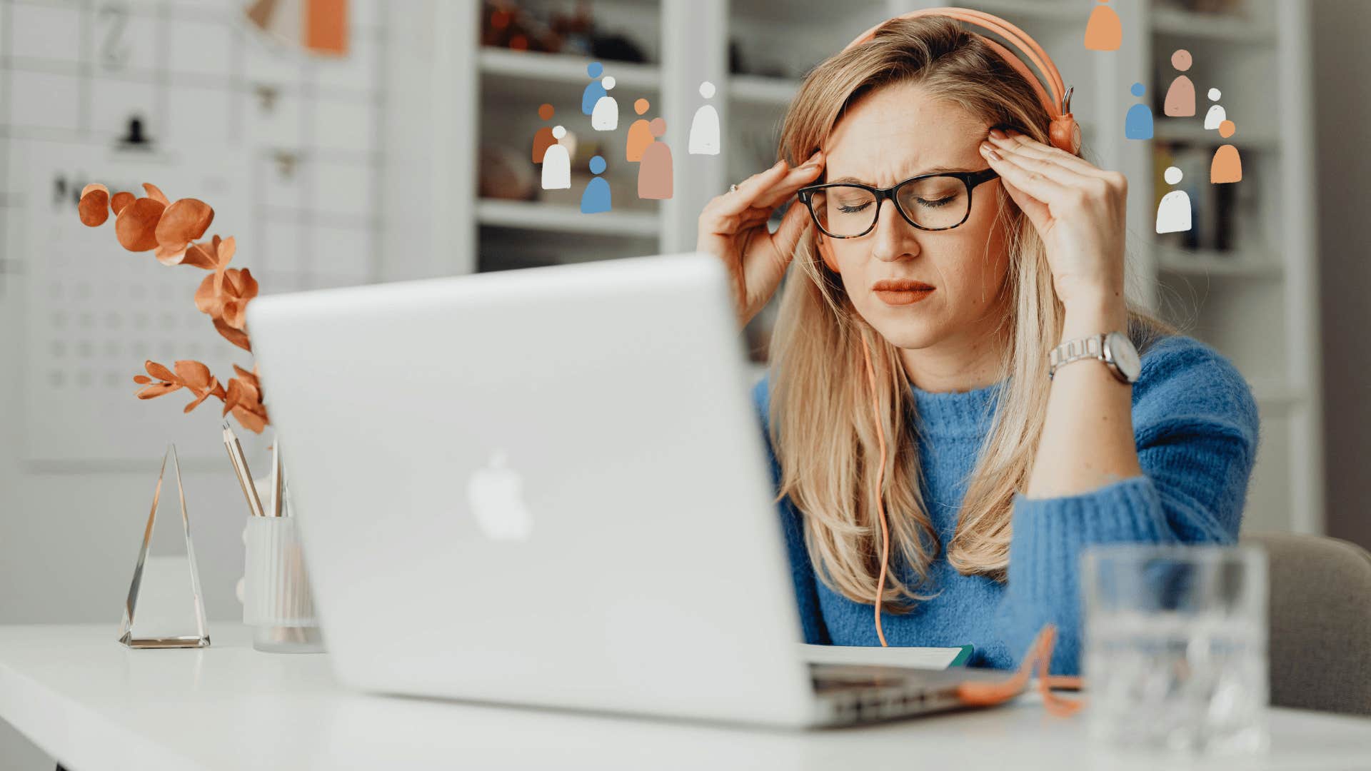 woman wearing a headset and rubbing her temples