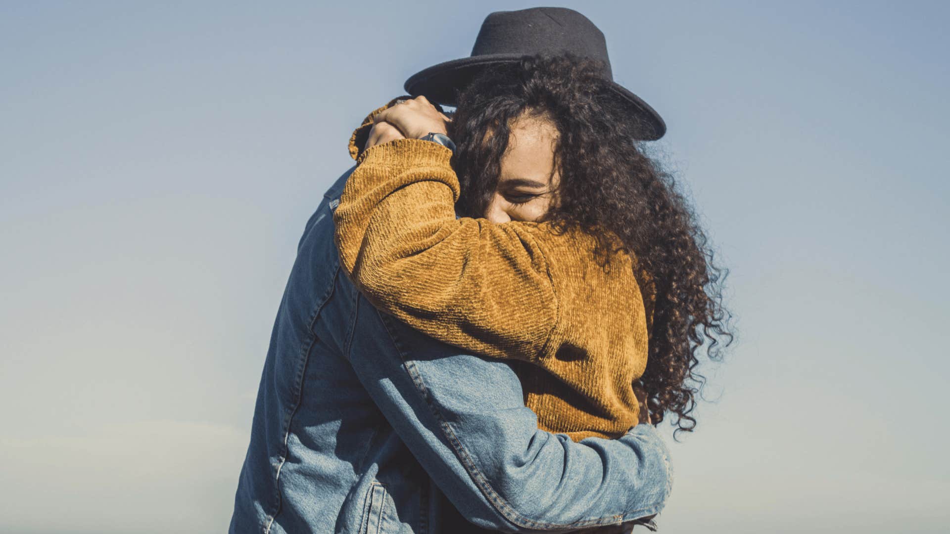 couple hugging each other close