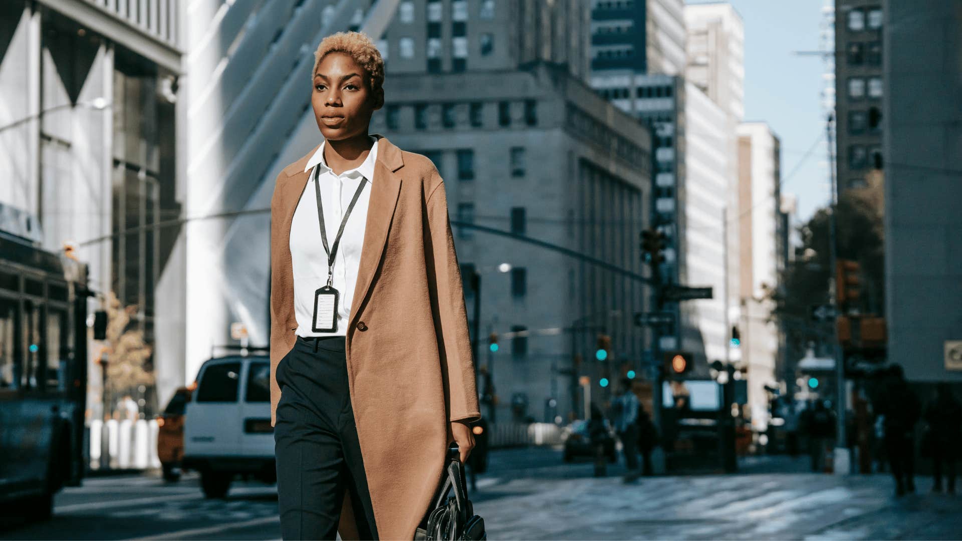 professional woman walking down sidewalk