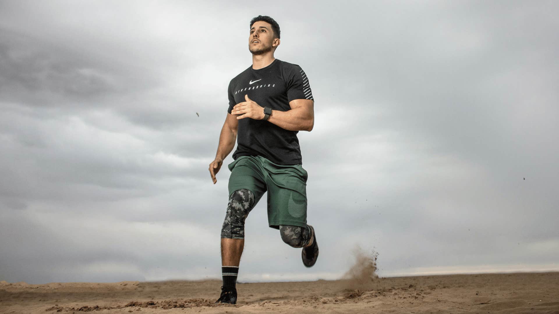 young man running on a beach