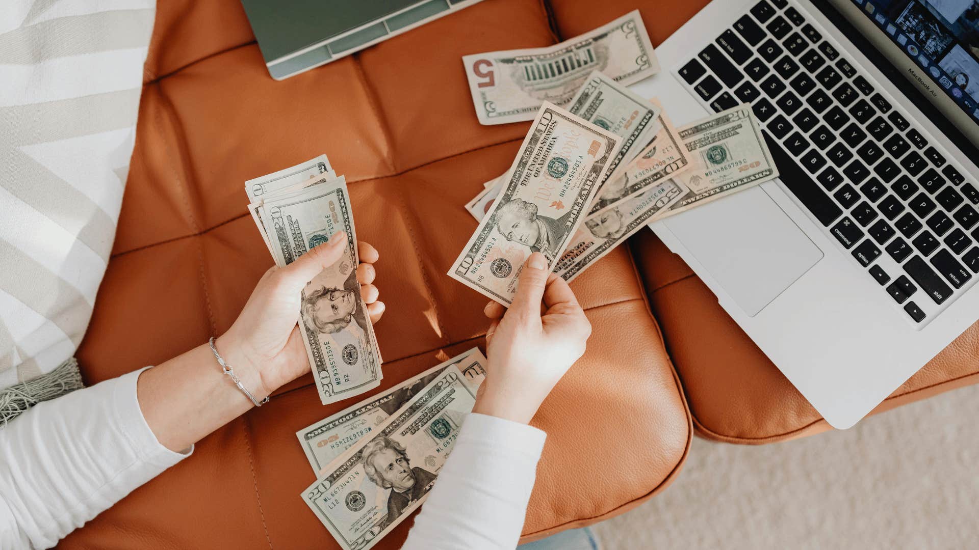 woman's hands counting money